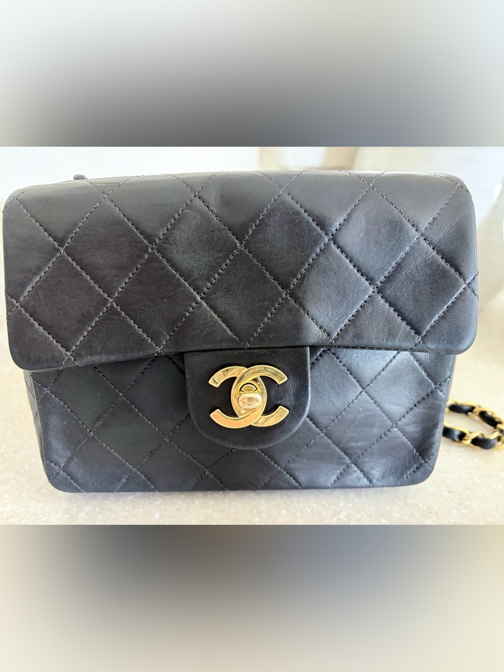 CHANEL Black Quilted Lambskin Mini Flap Bag with Gold Chain
